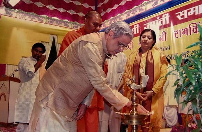 Lighting the ceremonial lamp to inaugurate a Jayanti commemoration