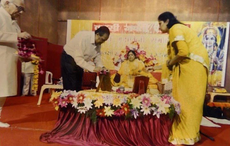 Honoured with garlands and offerings by devotees at a commemorative function